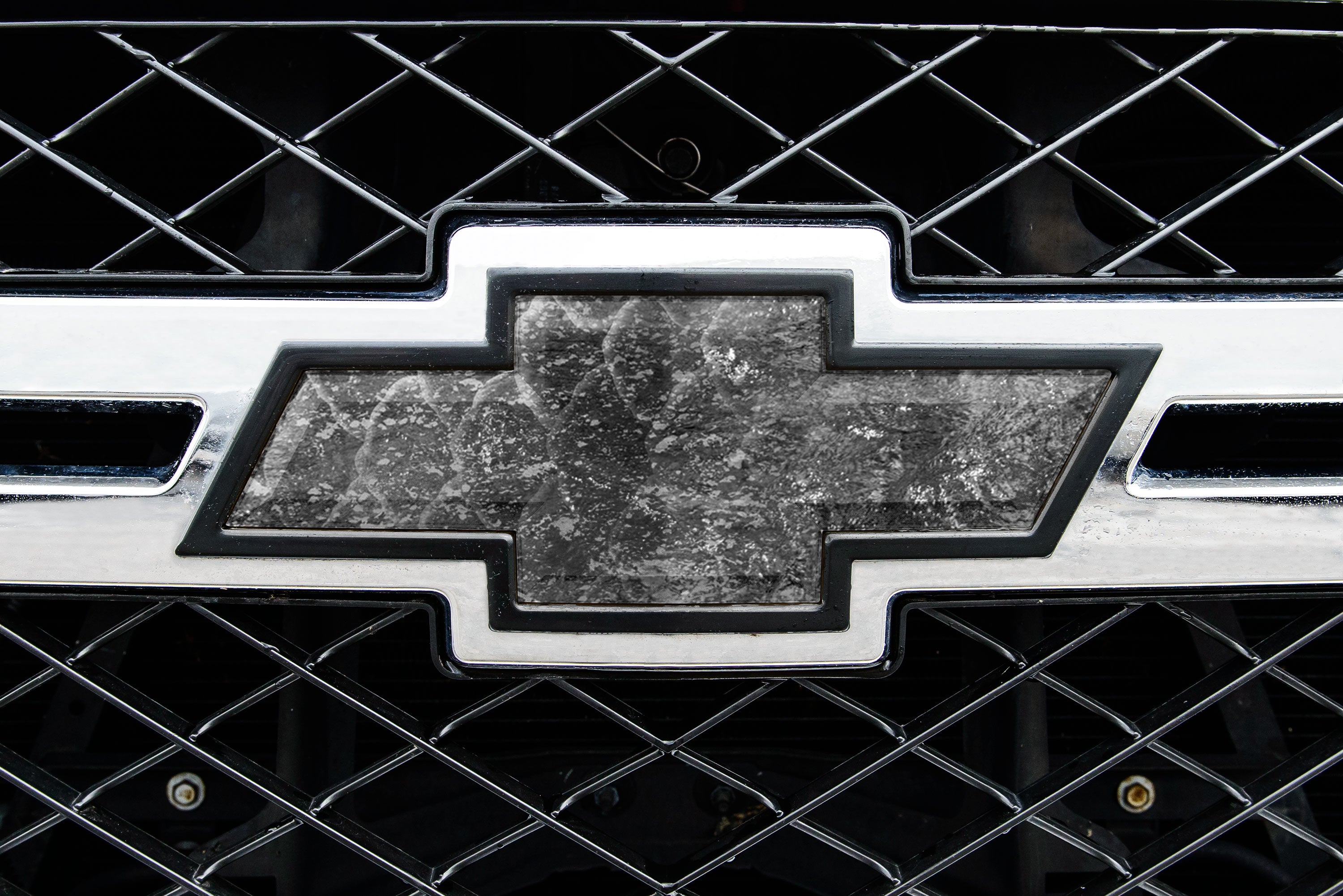 Universal auto emblem peel and stick vinyl with genuine Mossy Oak camo in Coast Cloudbank pattern