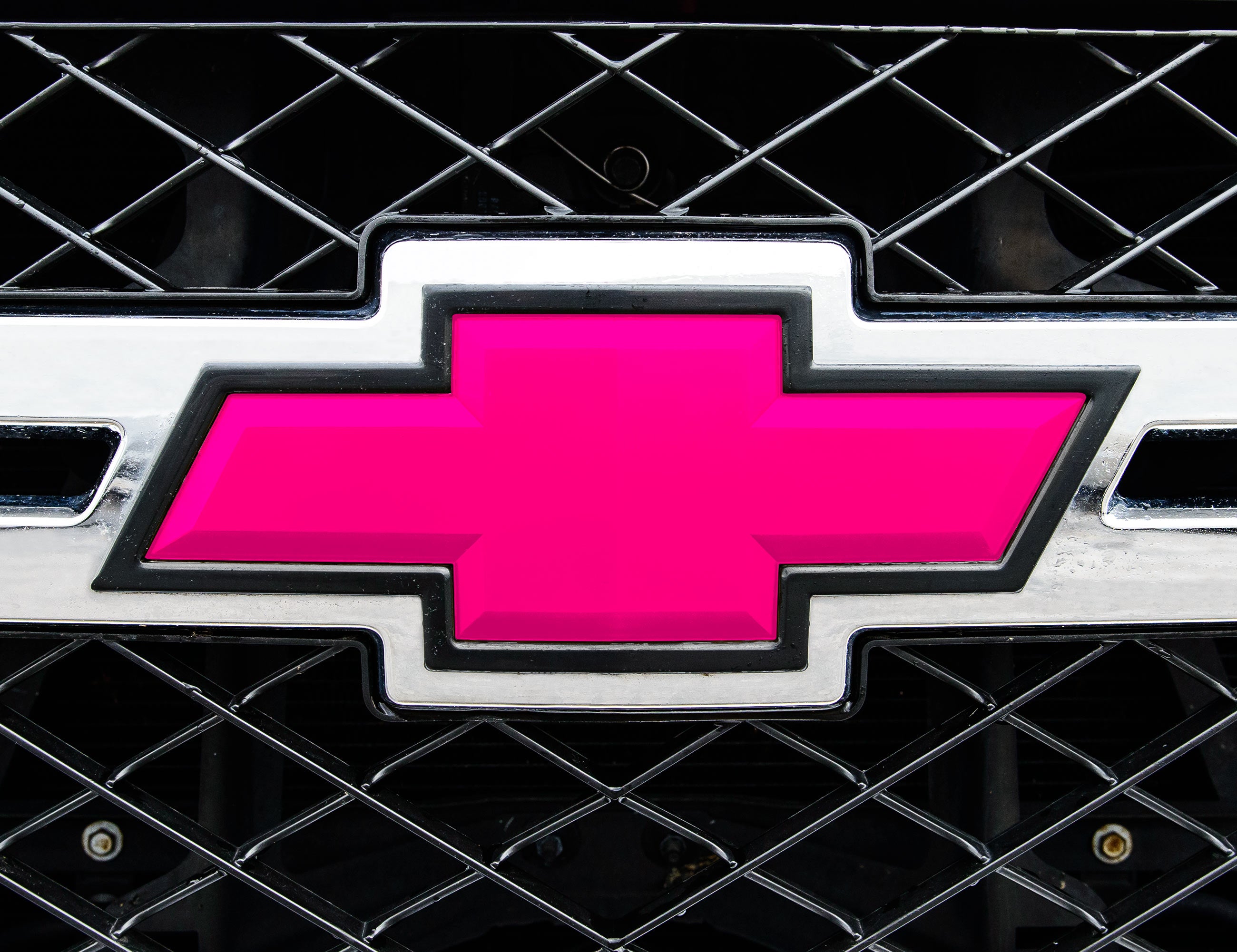 Universal auto emblem vinyl overlay in pink