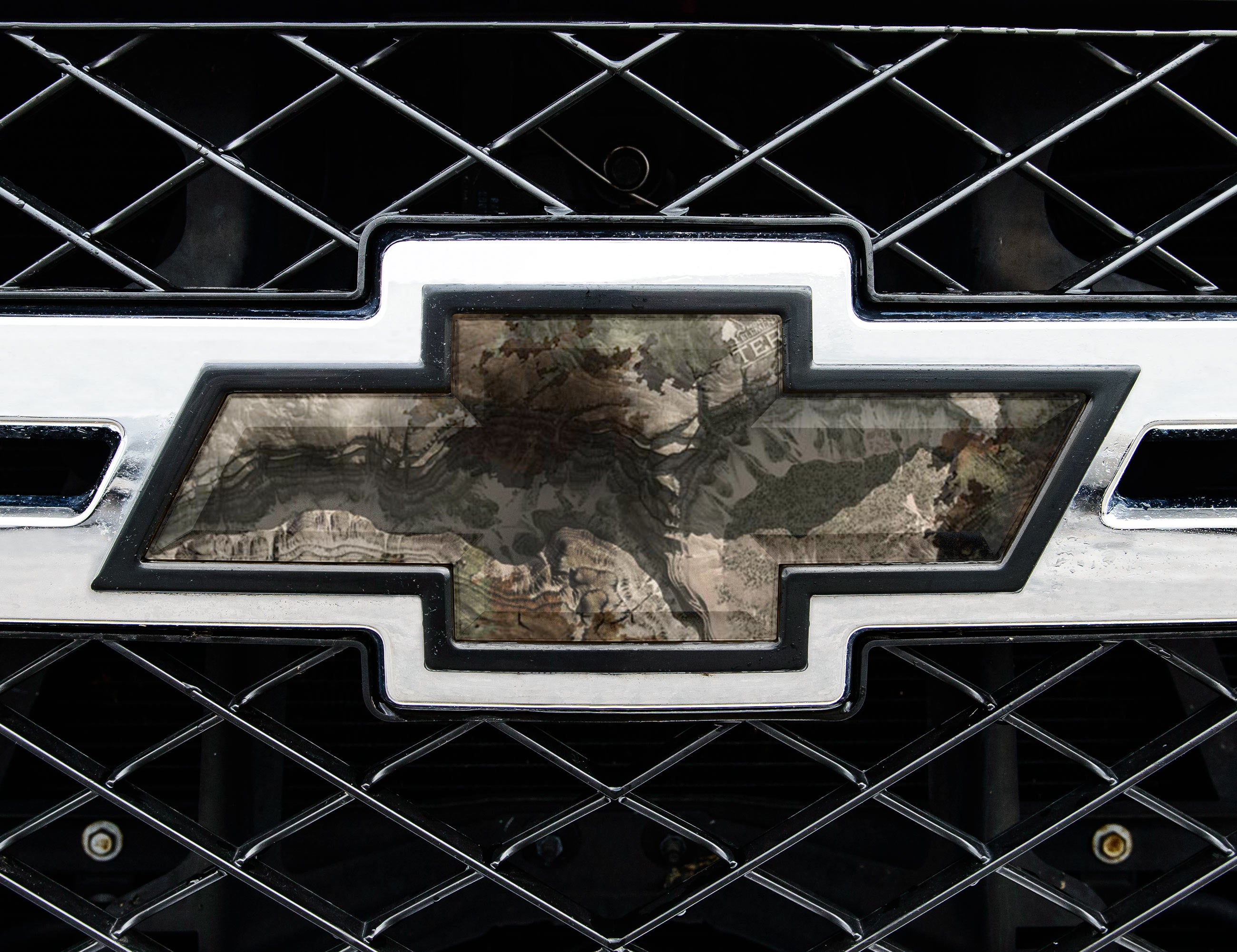 Universal auto emblem peel and stick vinyl with genuine Mossy Oak camo in Terra Gila pattern