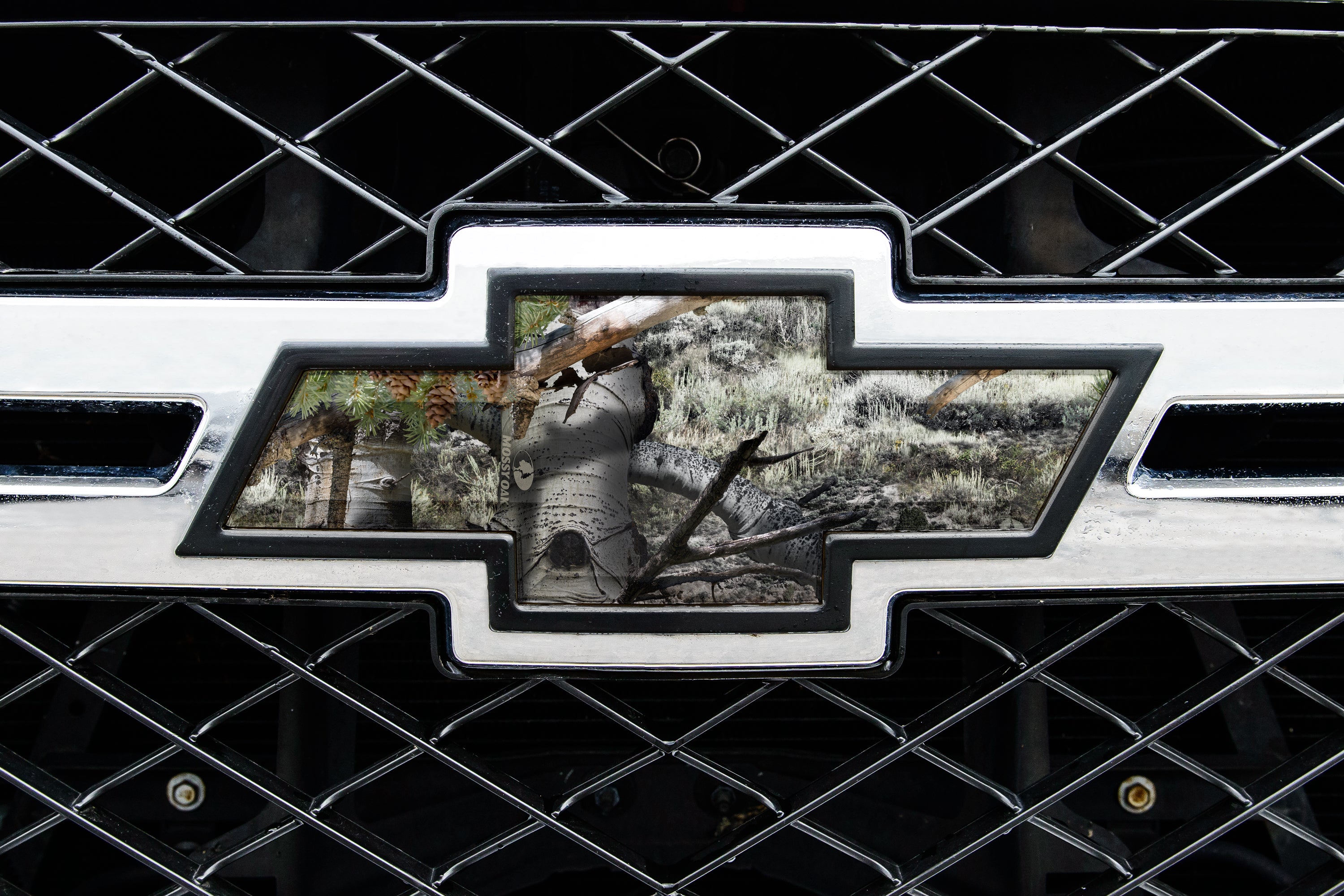 Universal auto emblem peel and stick vinyl with genuine Mossy Oak camo in Mountain Country pattern