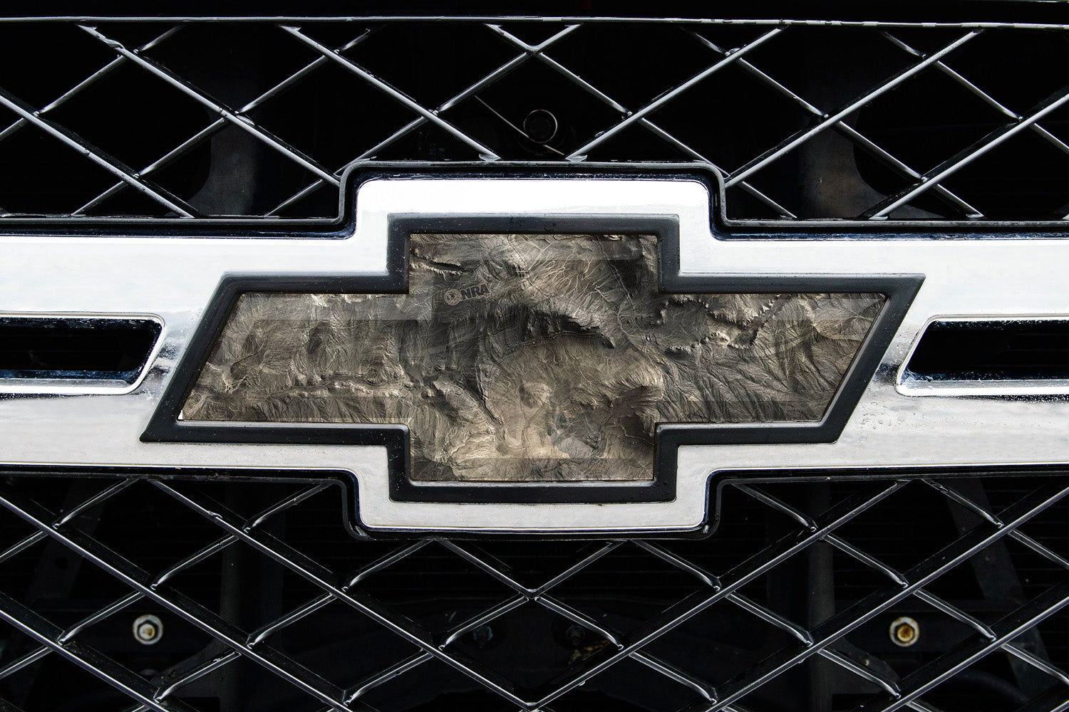 Universal auto emblem peel and stick vinyl with genuine Mossy Oak camo in Overwatch pattern
