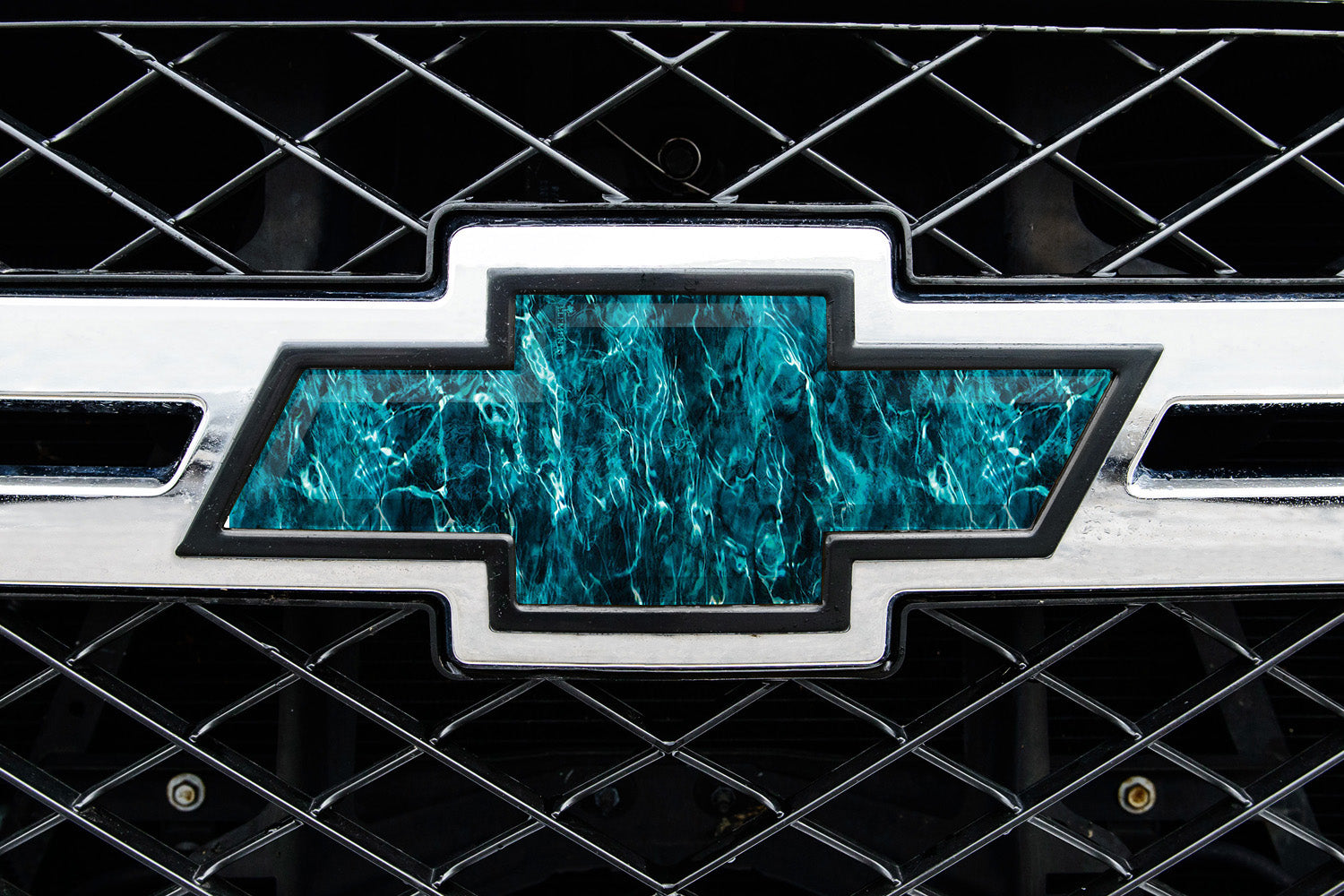 Universal auto emblem peel and stick vinyl with genuine Mossy Oak camo in Seawater pattern