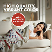 Woman lying on a couch with an America 250 We the People themed blanket, text about color quality and durability.