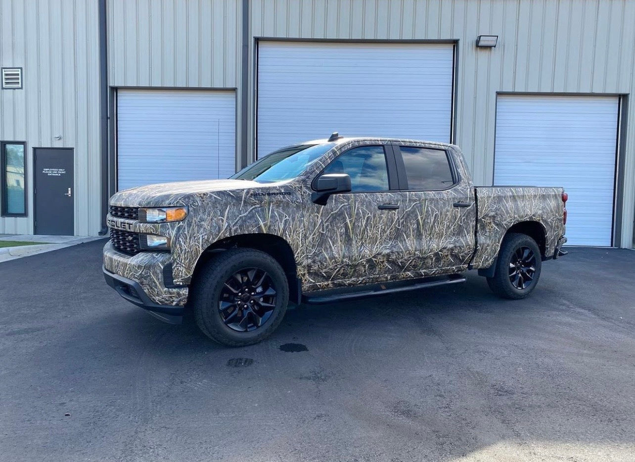 4th generation Chevy Silverado in Mossy Oak Graphics full size crew cab pick up truck vinyl wrap in Shadow Grass Blades camo pattern.